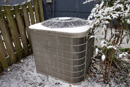 hvac system covered in snow
